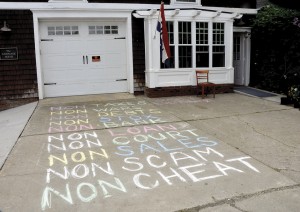 An improptu manifesto was chalked on the sidewalk in front of the 99 Gallery Sunday afternoon.  In addition to presenting art shows, the gallery will also provide a home for NEK 99 %, according to its founder, Diane Peel.  Photo by Joseph Gresser