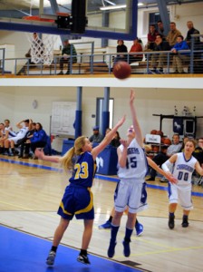Craftsbury Charger Mackenzie Blaney (center) takes a shot against Websterville Warrior Abby Fifield (left) as fellow Charger Janet Bohannon looks on.  Photos by Richard Creaser