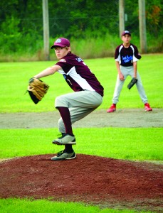 North Country All-Star Aiden Gariepy takes to the mound against the Hartford All-Stars as second baseman Derrick Breault looks on.  A series of thunder and rain delays extended the opening round of the tournament on Friday night.  Photo by Richard Creaser