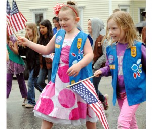 Girl Scout Daisies Eva Thompson (left) and Bianca Davis of Barton Troop #30813 lent a festive air to Barton's annual Memorial Day parade on Monday.  Like their namesake flowers, the Daisies provided a welcome burst of color amidst the rain showers.  The Daisies marched alongside their fellow Girl Scouts from Barton Troop #30053.    Photo by Richard Creaser