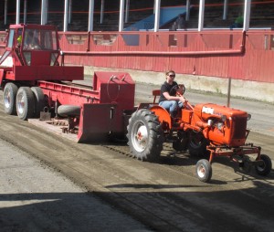 Hannah Roberts, 13, of Newport Center opened Sunday's tractor pull at Roaring Brook Park in Barton on her 1950 Allis-Chalmers C tractor.  Hannah, who is a seventh-grader at North Country Union Junior High School, is pictured here in a pull-off for the 2,750-pound stock class, in which she took second place with 312 feet, 3.24 inches.  Photo by Natalie Hormilla