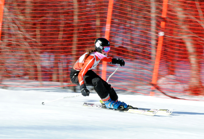 Colchester's Margaret Rodriguez bends into a turn during Friday's Alpine meet at the Jay Peak Ski Resort hosted by North Country Union High School. Rodriguez would finish in nineteenth spot.  Photo by Richard Creaser