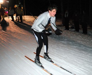 North Country's skiing executive Dan Decelles cruises downhill during Thursday night's North Country-hosted night relays held at the Craftsbury Outdoor Center.  