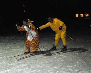 It’s not every day that a tiger tags off the relay to his short-necked giraffe Nordic ski partner.  And yet that is precisely what happened when Lyndon Institute's Daniel Chen (right) tagged Jayan Xie at the North Country-hosted night relays in Craftsbury on Thursday. Photo by Richard Creaser 