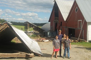 Pictured here next to the remains of the high drive roof on the left is the Coe family.  James Coe and Nella Cargioli Coe are in the back, and their children Isabella Coe (left) and Jude Coe (right) are in the front.  Photo by Nathalie Gagnon-Joseph