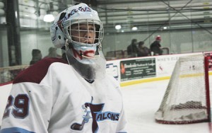 Falcons goalie Dana Marsh faced a relentless Lakers squad.  In a melee of black jerseys and put-backs, Marsh gave up four goals in a minute and a half in the second period.  