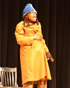 Chris Everett of the Improbable Players shows what a stereotypical alcoholic looks like, featuring a “big ugly coat that’s also their house,” a single glove with the fingers removed so they can do drugs and open bottles of alcohol more easily, and a big knit hat.  