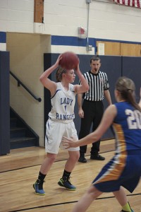 Molly Horton looks for an outlet against the Yellow Jackets scrappy defense.