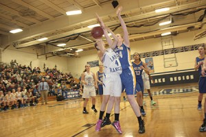 Katie Neal goes up for a shot from the low post against Yellow Jacket defender Lauren Juehlar.