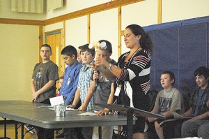 From left to right, Riley Sanville, Bruce Reagan, Tyler Lucas, and Curtis Bonneau explain how an anemometer, or wind speed sensor, works while their teacher Zarah Savoie holds up their model and their classmates Jeremy Lapan-Ward and Ben Longley look on.  Photo by Nathalie Gagnon-Joseph