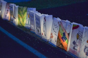 The American Cancer Society’s Northeast Kingdom edition of Relay for Life took place in Newport on Saturday night.  Luminarias commemorating cancer victims and survivors were placed along the track at North Country Union High School and lit at nightfall.  Photo by Nathalie Gagnon-Joseph