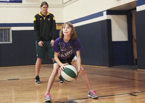 Erica Thaler of Glover learns to play the post from University of Vermont center Gracia Hutson.  