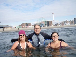 From left to right:  Meghan Tucker, David Tucker, and Brynna Kate Tucker, swimming off of Coney Island on Thanksgiving Day in 2008. 