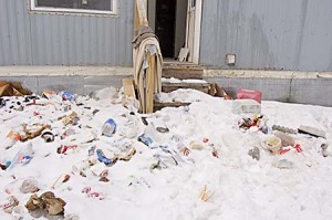 Rose Warner found this pile of trash outside a trailer she and her husband, Vernon, rented in July.  They said they were paid only $300 rent over the course of several months, learned by accident that their tenant had left, and found the place a wreck.  Photo by Tena Starr