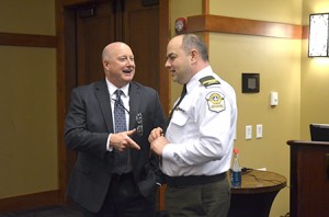 State Police Lieutenant Michael Manning (left) who heads Homeland Security at the state Division of Emergency Management and Homeland Security, has a few jovial words with Lieutenant Daniel Campagna Sûreté du Quebec after Tuesday’s session of the cross-border workshop.  Creating such friendships is a major point of the program, Lieutenant Manning said.