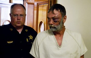 Orleans County Deputy Sheriff Phil Brooks with Jeffrey M. Ray of Brownington, who pled innocent in Superior Court Monday to first degree murder.  Mr. Ray, who is being held without bail, is accused of shooting another Brownington man, Rick Vreeland, Monday morning.  Photo by Joseph Gresser