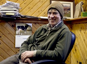 James Coe takes a moment to chat in his office at Andersonville Farm in West Glover.  Photo by Joseph Gresser