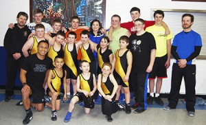 NEK Python wrestlers, in the front, and Lake Region wrestlers, in the back, pose with their guest, Xavier Gilbert, who is in the front row, second from the right. Pictured, in the front, from left to right, are Willie Elman, Cuzian Comeau-Elman, Xavier, and Austin Lathe.  In the middle are Nick Stone, Bryan Stafford Derek Guillette, Noah Simpson, Cally Sanville, Austin Descheneau, and Francis Stafford.  In the back are Coach Richard Roberts, Colin Allard, Joshua Roberts, Logan Dolloff, Isabel Wildflower, Kaleb Gibson, John Stafford, Bryce Patenaude, and Coach Wesley Nutter.  
