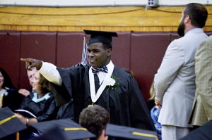 Keenan Warner acknowledges his cheering section after receiving his diploma Saturday evening.  Photo by Joseph Gresser