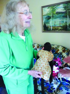 Stella Halpern with the doll she bought at auction ten years ago.  She’s sure the handmade toy has a story and hopes the Old Stone House Museum and students at the East Burke School figure out what it is.  Photo courtesy of Peggy Day Gibson