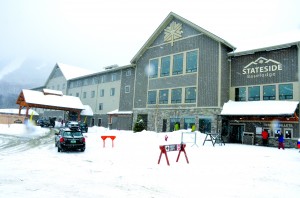 The new Stateside Baselodge gets a welcome baptism of snow on its opening day, Friday, December 20.  It was filled to capacity when the doors opened that morning.  Bill Stenger, co-owner of Jay Peak, said the new hotel is designed to provide quality lodging at a price below that of the resort’s other two hotels.  