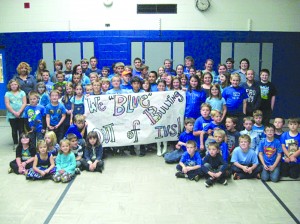 Irasburg Village School students wore blue to take part in “Stomp Out Bullying,” on October 7.  October is National Bullying Prevention Awareness Month.  To signify its importance, STOMP Out Bullying created Blue Shirt Day, which is the World Day of Bullying Prevention.  Pictured, sitting in the front row, from left to right, are:  Mia Moore, Harley McCormick, Holden Lefebvre, Brody McDonald, Chase Monfette, Owen Brochu, Hutch Moore, and Dominick Daigle.  Sitting in the back row are:  Katelyn Turgeon, Abby Mcdonald, Sam Fecher, Thomas Annis, Ava Carbonneau, Joey Annis, Ryan Moulton, Seth Moulton, Tyson Horn, Hunter Baraw, Cy Boomer, and Zachary Rooney.  Standing in the front row are:  Dominick Fontaine, Bronson Smith, Logan Verge, Freddie Moore, Tyler Goodridge, Wyatt Gile, Rosie Fecher, Abigail Moore, Nicole LaFratta, Madison Berry, Mckenna Cartee, and Isaiah Brochu.  In the next row are:  Alyssa Butler, Byanna Palmer, Nicole Parrish, Hunter McElroy, Peyton Lackie, Garrett Labounty, Tyler Young, Keira Butler, Kaylee Jewer, Harlee Miller, Nicole Dutton, Mercedez Hodgdon, Dakota Jones, Taylor Schneider, and Michael Kittredge.  In the next row are:  Beverley Hall, Tyler Jewer, Dillon Stebbins, Josh Cole, Dinah Daigle, Glen Cartee, Drew Drageset, Connor Lanou, Dawson Stebbins, Emma Downs, Denise Goodridge, Seraphina Fecher, Abigail Bromley, and Sarah Cousino.  In the last row are:  Desiree Ouellet, Tucker Wilson, Jordan Fecher, Kiara Hodge, Brendan Dutton, Cody Lanou, Garrett Gile, Jacob Young, Nick Young, Maureen Currier, Emily Wells, and Francis Annis.  Photo courtesy of Paul Simmons