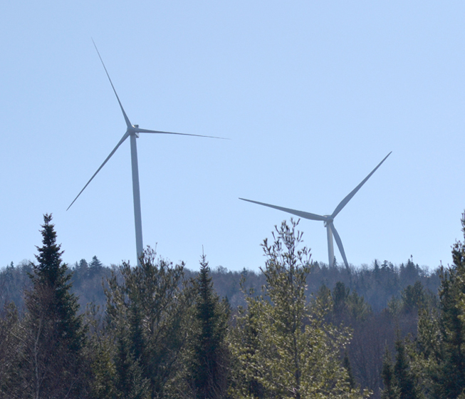 Wind towers at Lowell Mountain, as seen from Irish Hill Road.  Photo by Bethany M. Dunbar